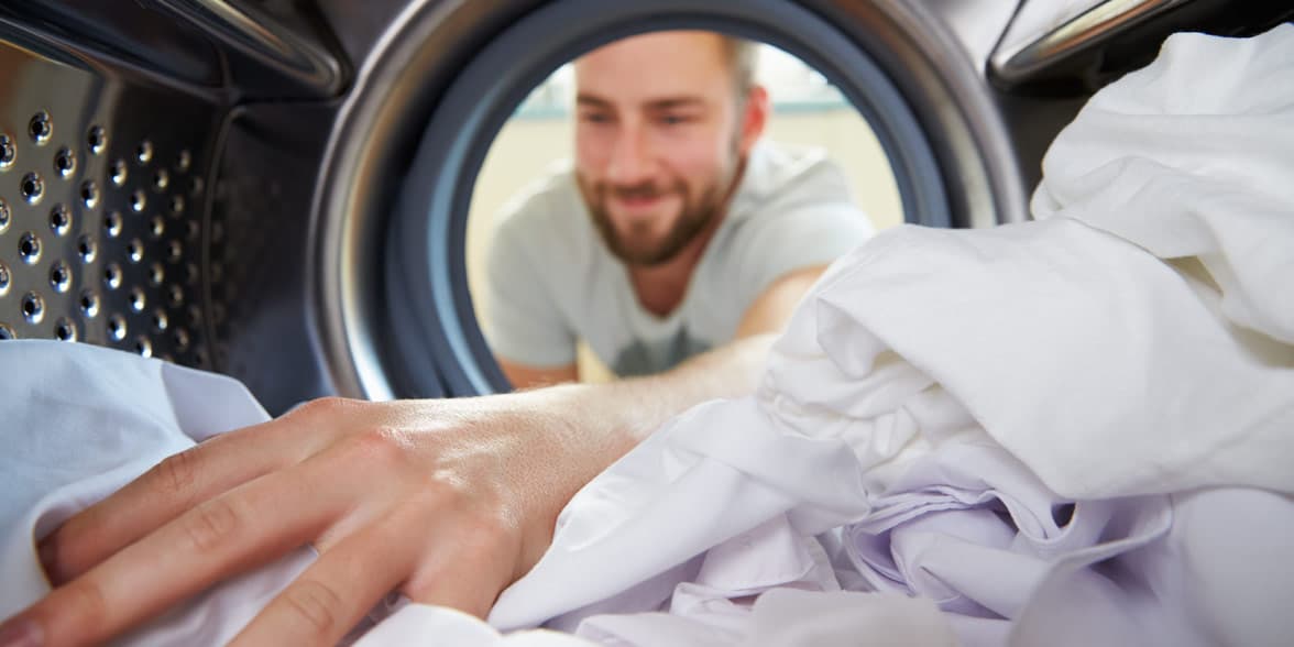 Photo of a man doing laundry